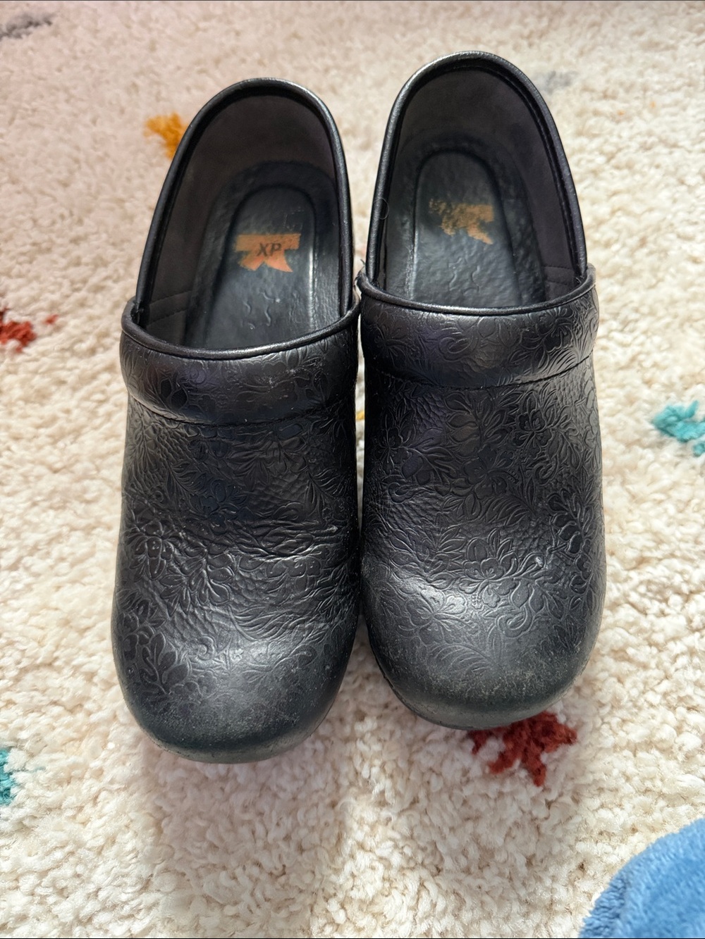 Dansko Black Slip-On Clogs with Textured Sole